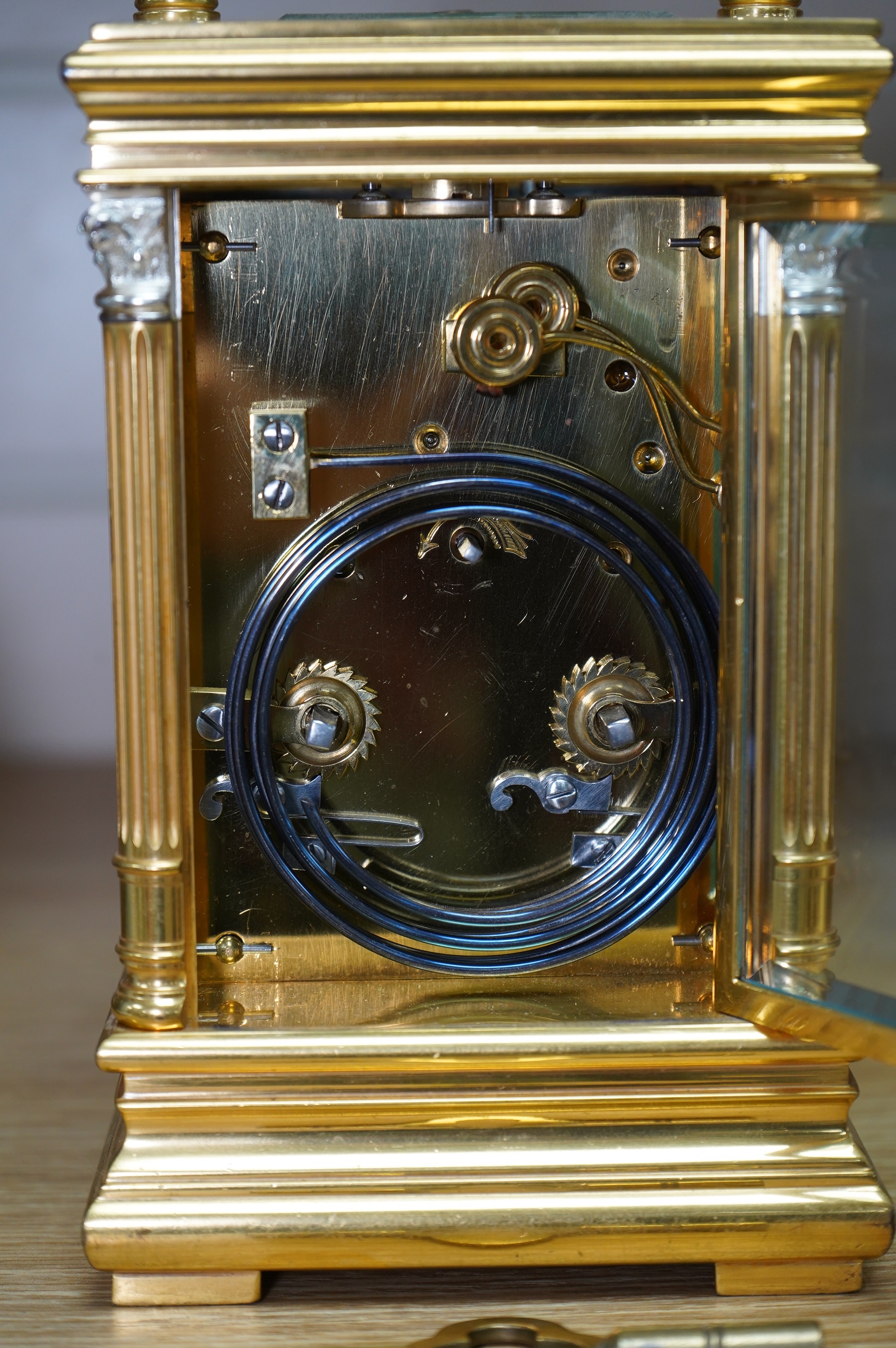 A French silvered and gilt brass hour repeating carriage clock with enamel dial, with key, 20cm high. Condition - good, untested